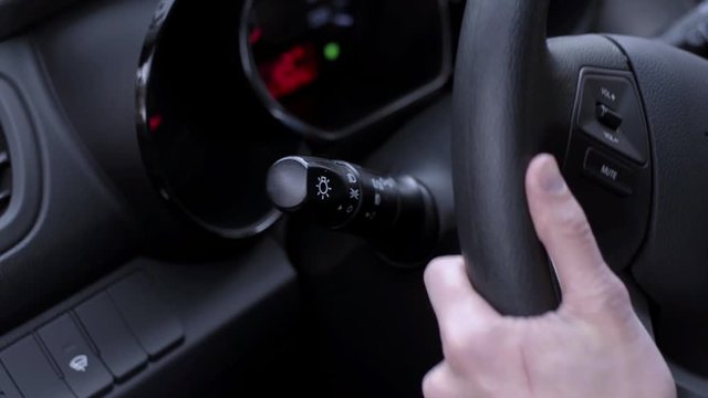 A driver turns on a blinker