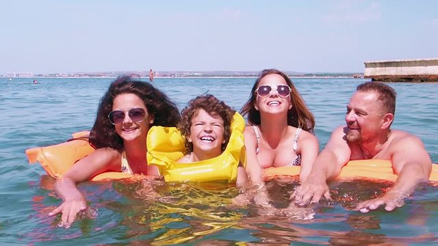 Happy family on vacation at sea. Slow motion.