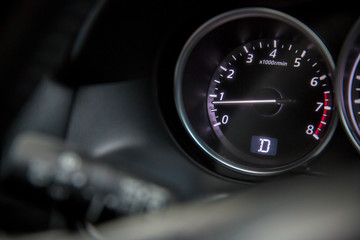Closeup photo of modern car tachometer. Car interior