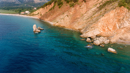 Aeriel view point of sheer cliffs raising from the sea.