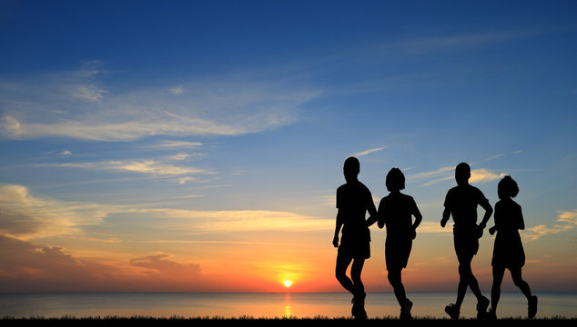 silhouette lover couple running on sunrise