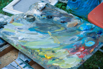 Blurred in the artist's paint palette.
