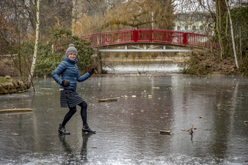 Woman on frozen pond in winter