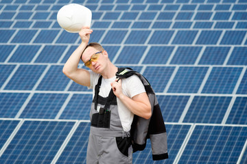Solar panels engineer with white cask