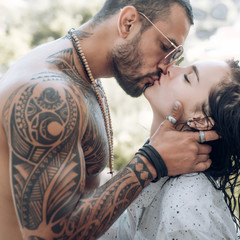 Naked woman and young man. Sensual Kiss. Passion and sensual touch. Concept of sensual and intimate...