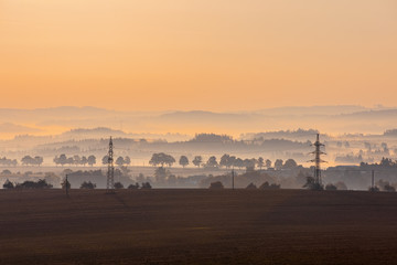 Autumn foggy sunrise landscape