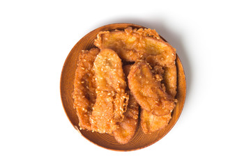 Fried bananas in plate isolated on white background, Kluay Tod - Thai dessert.