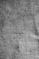 Old vintage linen cloth textile. Burlap rustic tumbled texture background.