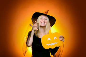Holiday halloween with funny carnival costumes on halloween background. Background decorated for...