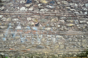 Antique natural stonewall. Old stone texture/background. Castle wall