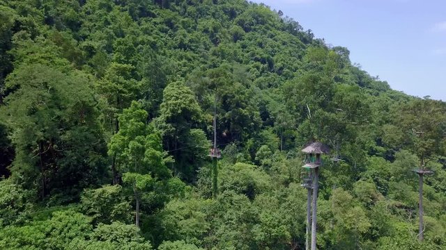 Aerial View of Tourists Riding on Zipline or Canopy Rope. Adrenaline Adventure on Vacation
