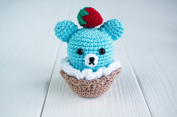 Amigurumi cake in the form of a bear cub. Knitted toy.