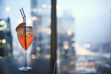 cocktail in a modern restaurant / glass with a bright cocktail in the fashionable interior serving in the restaurant, nightclub