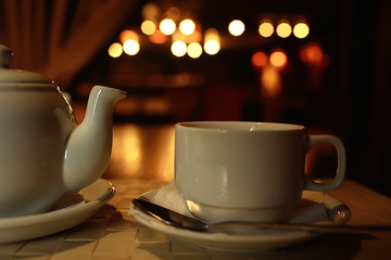 English tea in a cafe / cup and kettle with five o'clock tea