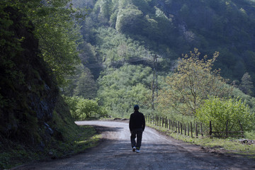 Obraz premium man walking in the forest