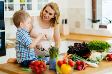 Mother and child preparing lunch
