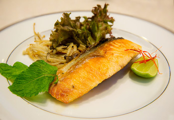 Top view of steak salmon and salad served on luxury white dish. healthy food. clean food concept. salmon high omega 3. image for background, wallpaper,menu list and copy space.