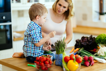 Mother and child preparing lunch
