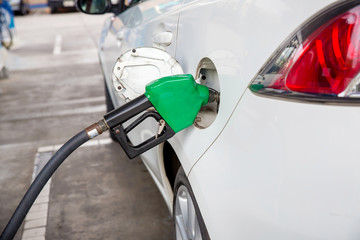 Naklejka premium Refill and filling Oil Gas Fuel at station.Gas station - refueling.To fill the machine with fuel. Car fill with gasoline at a gas station. Gas station pump. 