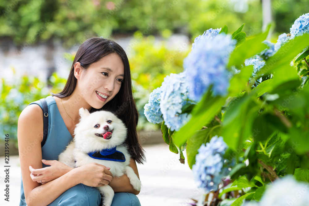 Sticker woman with her pomeranian dog at outdoor park