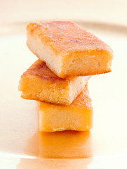pieces of marzipan on golden background