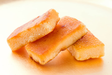 pieces of marzipan on golden background