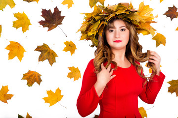 Naklejka na ściany i meble girl with a wreath of autumn leaves on her head