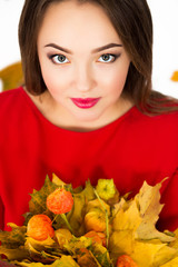 girl with a bouquet of leaves on a white background