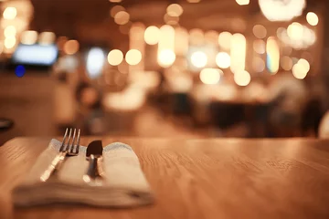 Rolgordijnen blurred background in restaurant interior / serving and details in blurred bokeh background, concept catering, restaurant modern © kichigin19