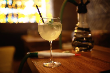 cocktail in a modern restaurant / glass with a bright cocktail in the fashionable interior serving in the restaurant, nightclub