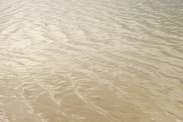 Waves and glare on the surface of the water. Lake. Background