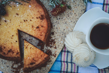 Breakfast. Coffee and pie with fruit filling on the table.