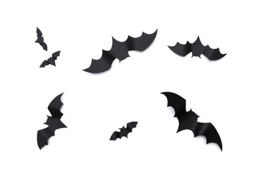 halloween and decoration concept - paper bats flying