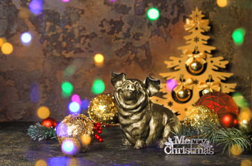 New Year or Christmas. Pig or wild boar on abstract dark background. The effect of bokeh. The...