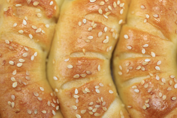 Freshly baked roll pastry with sesame