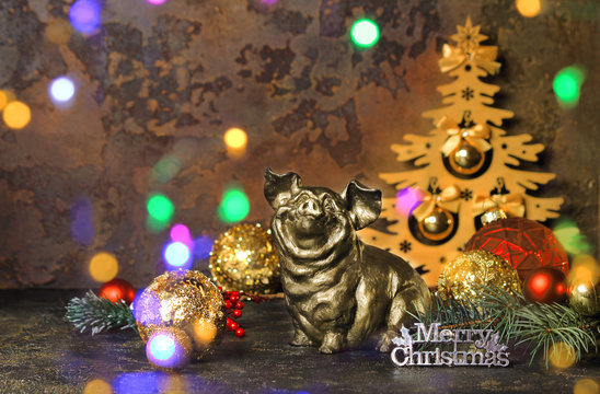 New Year or Christmas. Pig or wild boar on abstract dark background. The effect of bokeh. The concept of abundance, prosperity and wealth multiplication. Selective focus, side view, copy space. - Powered by Adobe