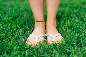 Feet of a woman wearing summer sandals