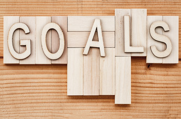 goals banner - text in vintage letters on wooden blocks