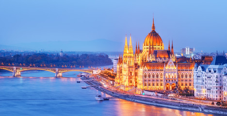 Fototapeta na wymiar Budapest skyline, Hungary - illuminated Hungarian Parliament in twilight. Spectacular Panoramic view on Danube river delta and bridge. Famous European travel destination. 