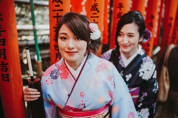 Two japanese girls wearing kimonos traditional clothes, lifestyle moments