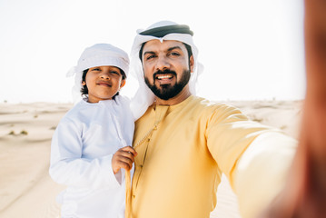 father and son spending time in the desert