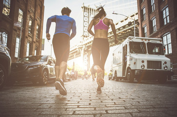 Couple running in New york - Powered by Adobe