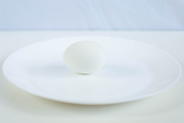 white egg on a white plate