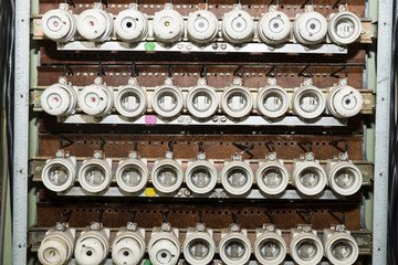 Old electrical fuse box with porcelain fuses