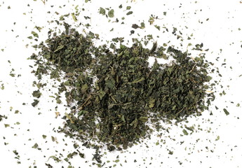 Dry, cut and sliced nettle pile, isolated on white background, top view