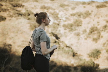 Fototapeta na wymiar Woman trekking in the valley