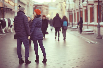 loving couple walking in the city view from the back