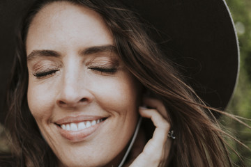 Brunette woman listening to music