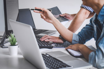 Writing codes and typing data code technology, Programmer cooperating working on web site project...