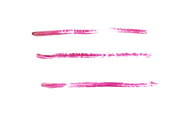 Red strip line made of nail polish isolated on white background.